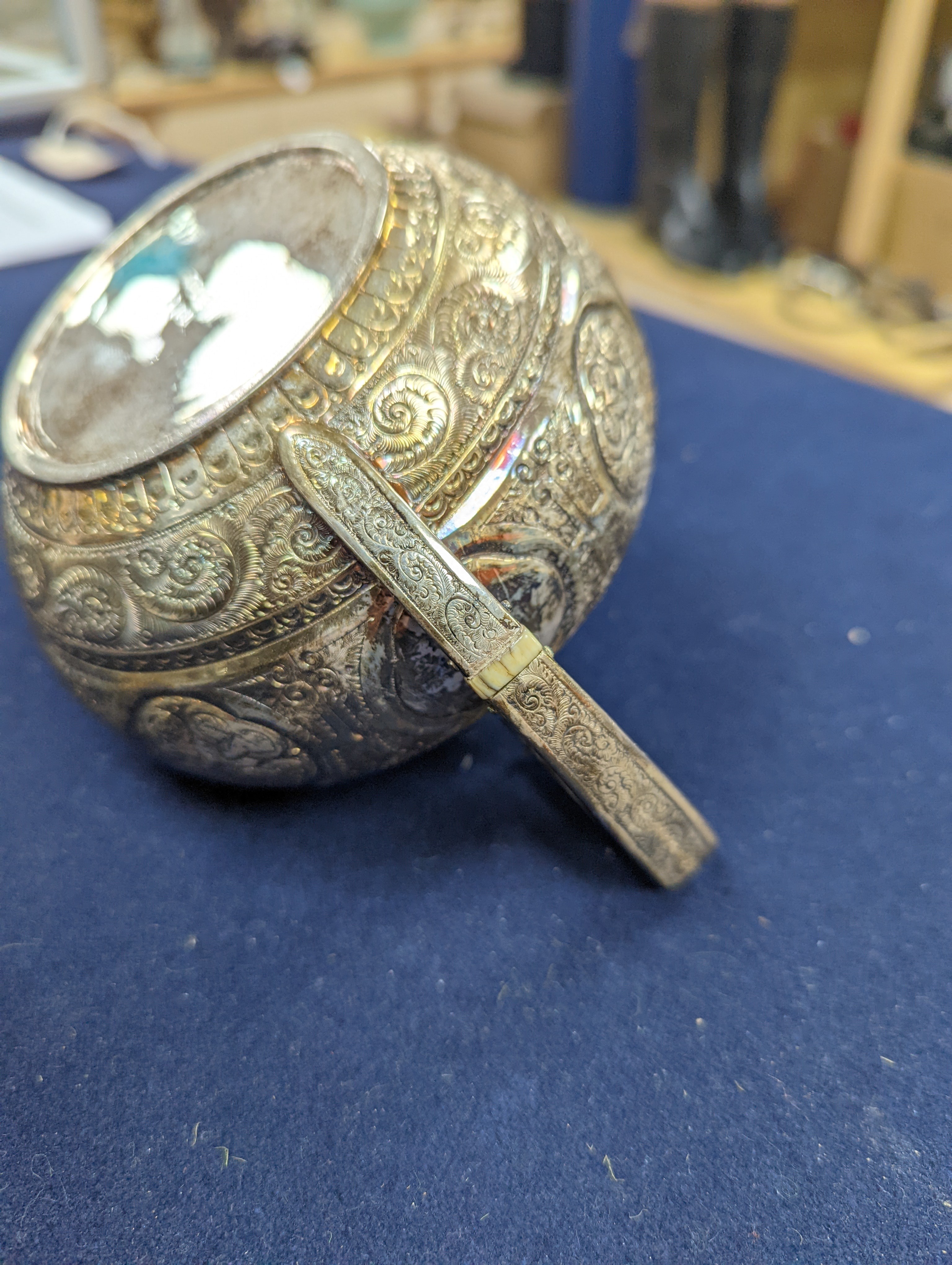 A WMF dish, Islamic white metal mounted photo album and a plated teapot and jug